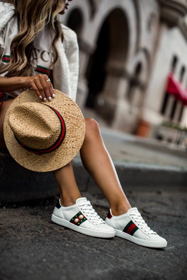 fashion blogger mia mia mine wearing gucci ace embellished sneakers