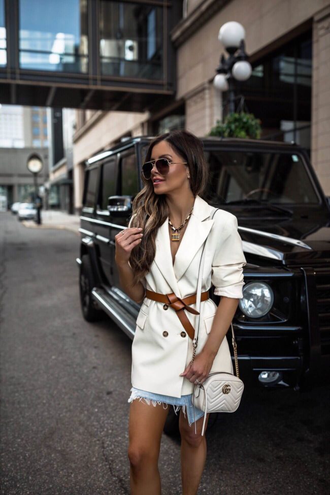 fashion blogger mia mia mine wearing a topshop white blazer with an agolde denim skirt