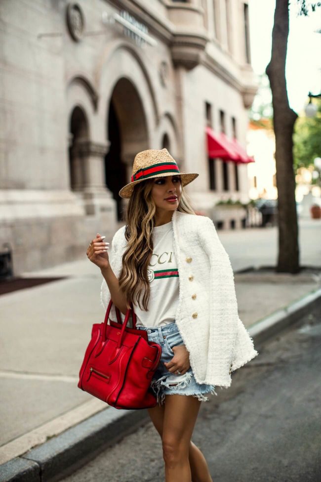 fashion blogger mia mia mine wearing a white tweed blazer with a gucci tee