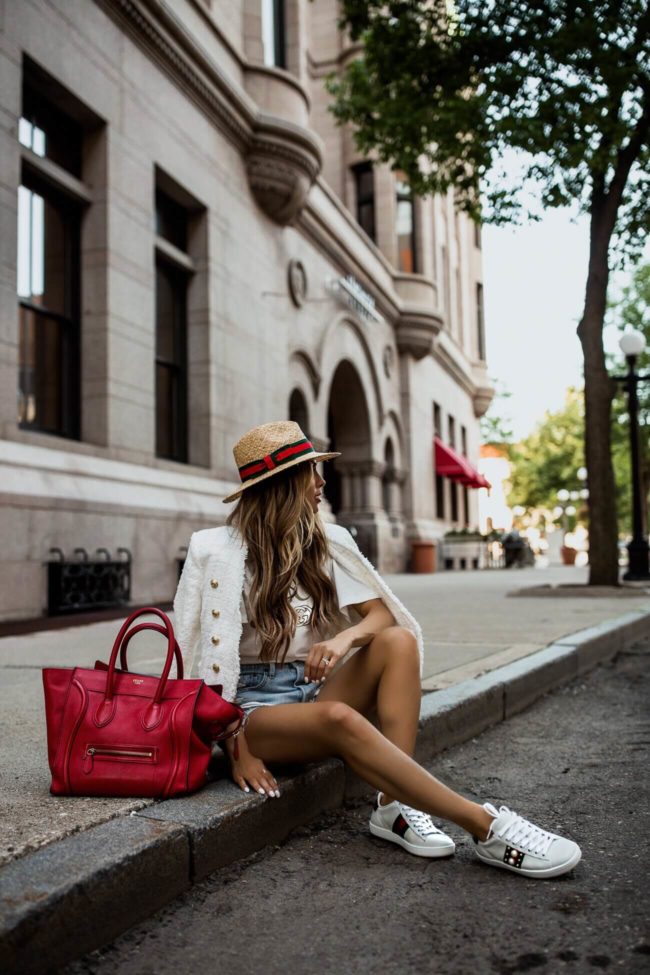 Fashion blogger mia mia mine wearing gucci sneakers and a red celine bag