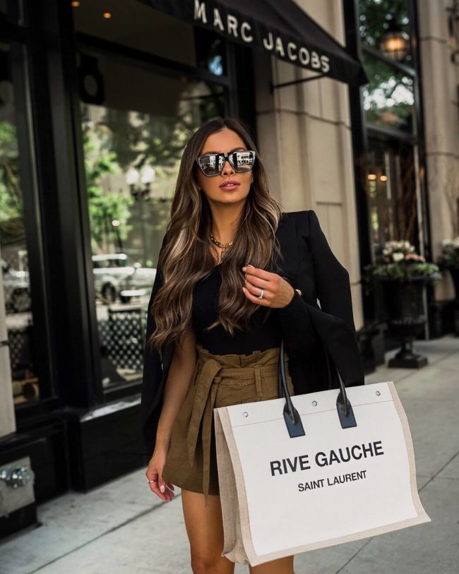 fashion blogger mia mia mine wearing a balmain blazer and a saint laurent rive gauche linen tote