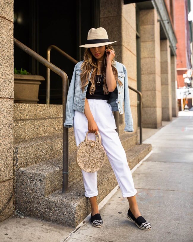fashion blogger mia mia mine wearing a denim crop jacket and white linen pants from walmart