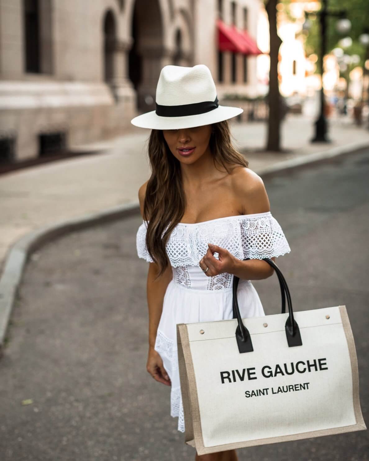 fashion blogger mia mia mine wearing a saint laurent rive gauche bag and a white panama hat