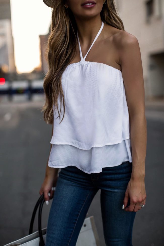 fashion blogger mia mia mine wearing a white halter top from the sofia jeans collection at walmart