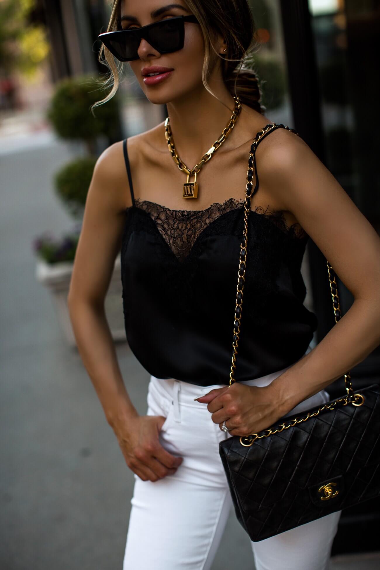 fashion blogger mia mia mine wearing a black lace cami and gold dior lucky locket necklace