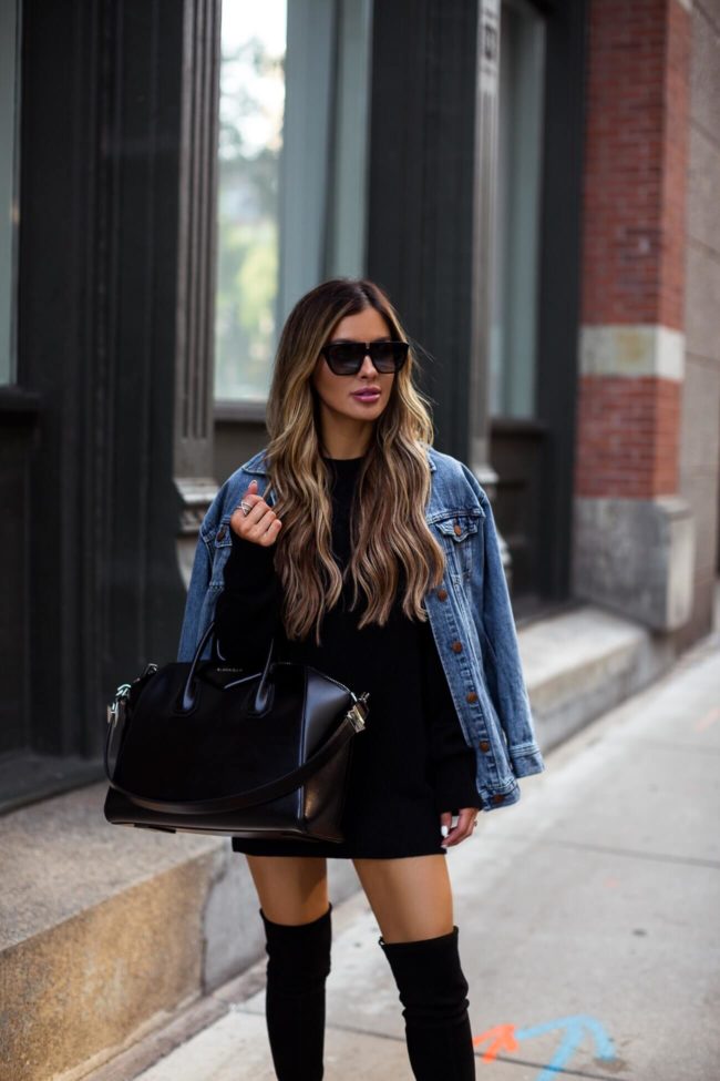 fashion blogger mia mia mine wearing a denim jacket and black sweater dress from the nordstrom anniversary sale 2019