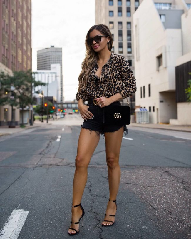 fashion blogger mia mia mine wearing a leopard shirt from the nordstrom anniversary sale and a gucci bag