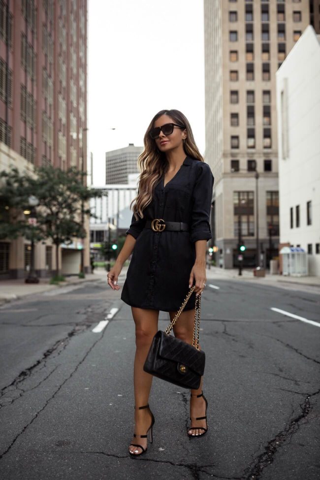 fashion blogger mia mia mine wearing a black shirt dress from abercrombie and a gucci belt