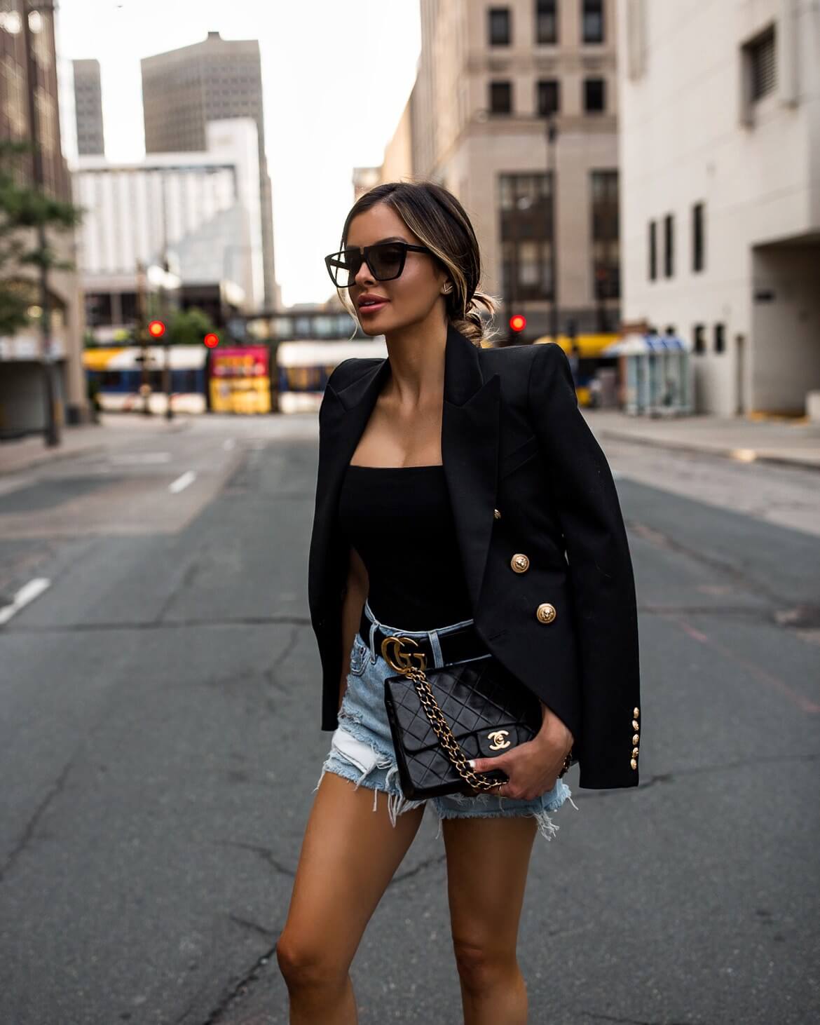 fashion blogger mia mia mine wearing a balmain blazer and a gucci belt