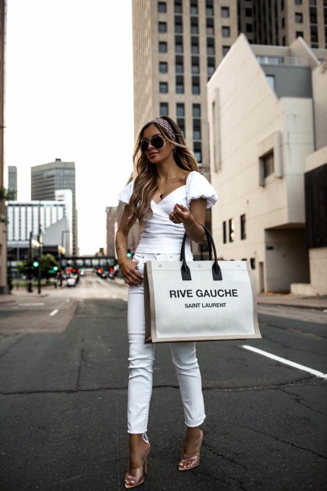 fashion blogger mia mia mine wearing a white linen top and white denim