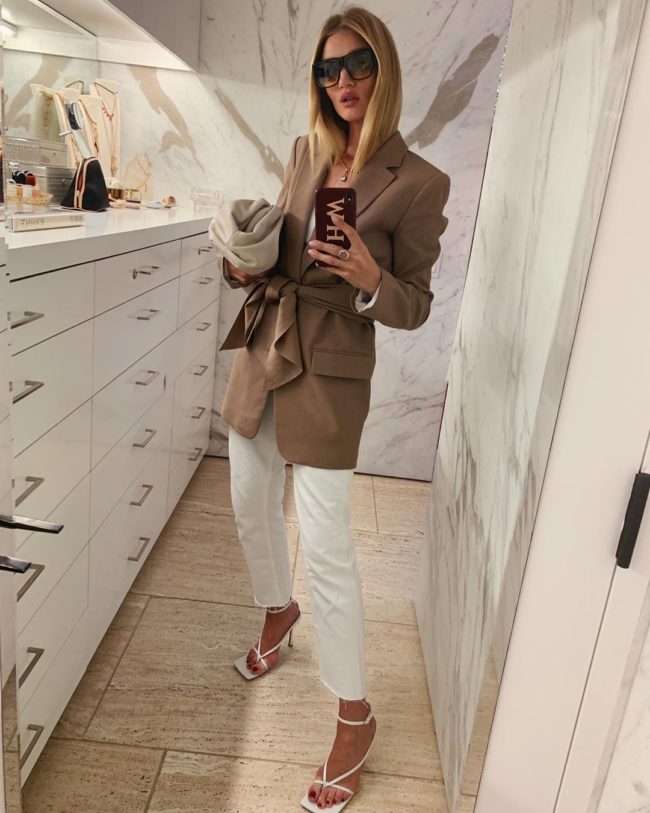 rosie huntington whiteley carrying a bottega venetta pouch