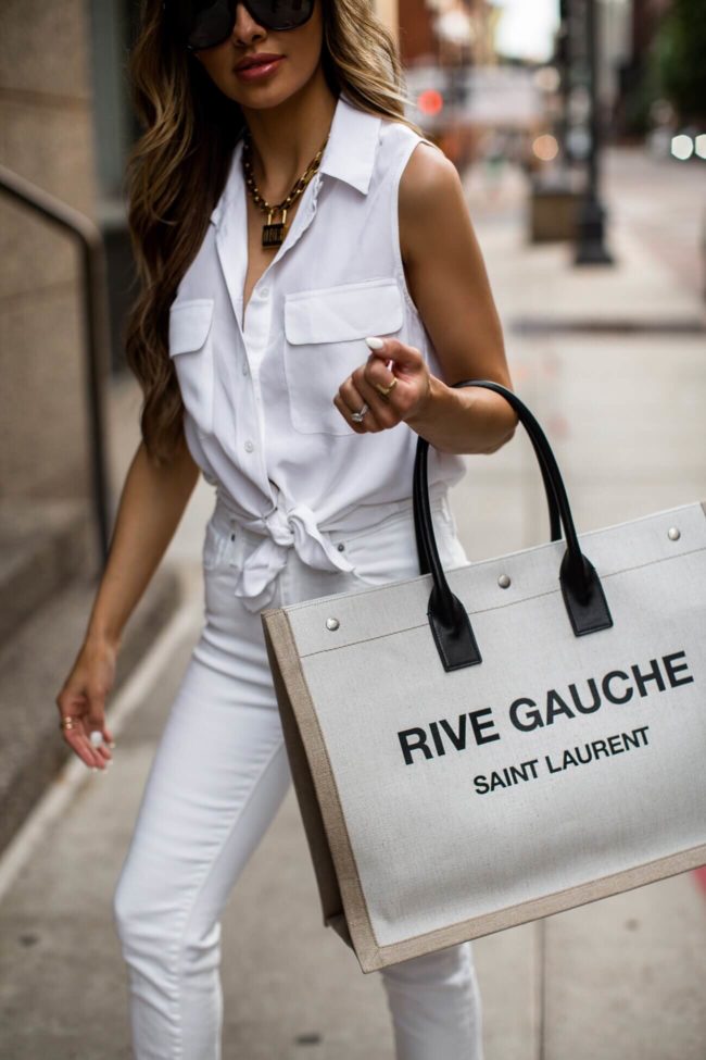 fashion blogger mia mia mine wearing a white equipment shirt and white levis jeans