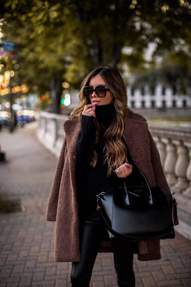 fashion blogger mia mia mine wearing a givenchy antigona bag and a teddy bear coat from walmart for fall