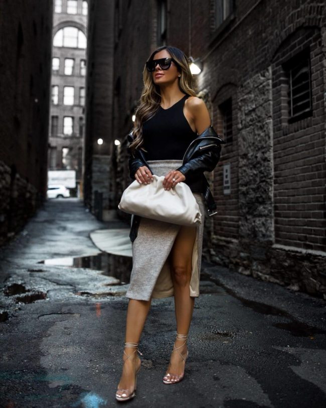 fashion blogger mia mia mine wearing a bottega veneta bag and a black bodysuit