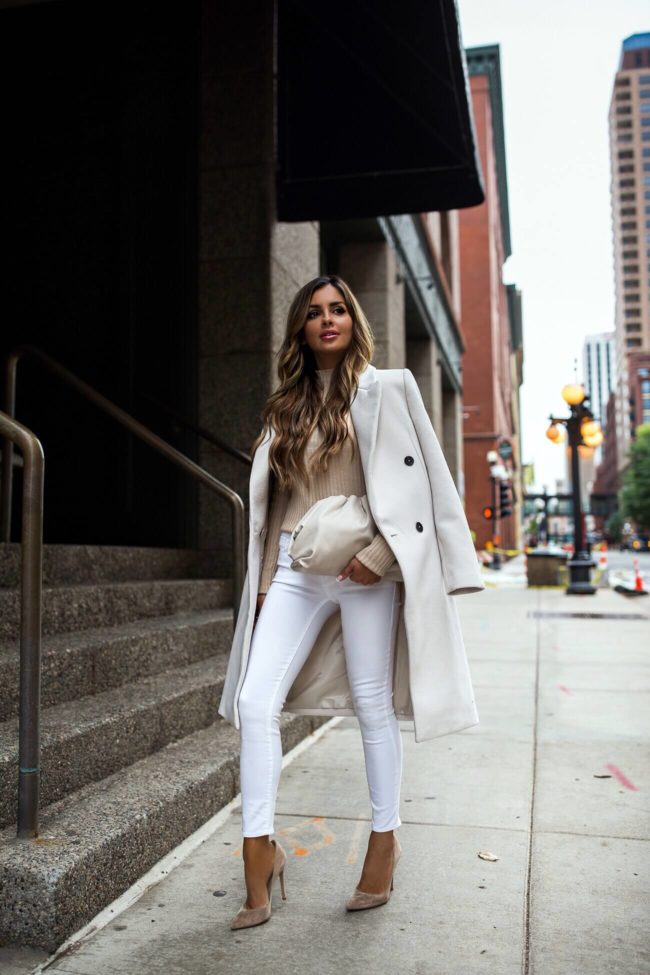 fashion blogger mia mia mine wearing a white coat and white denim