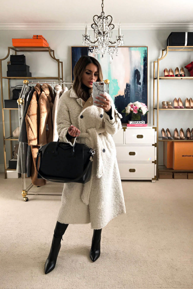 fashion blogger mia mia mine wearing a white shearling coat from mango