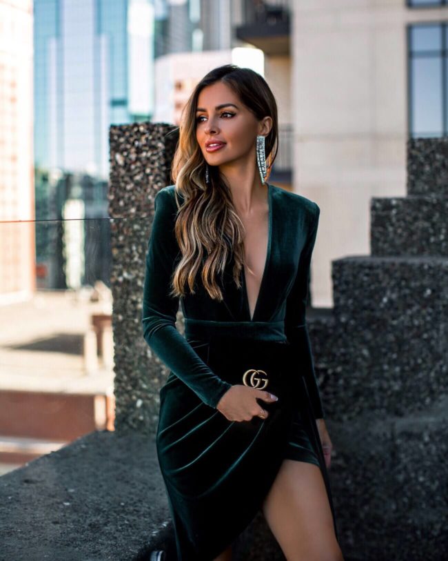 fashion blogger mia mia mine wearing a velvet dress and gucci bag at hotel ivy minneapolis