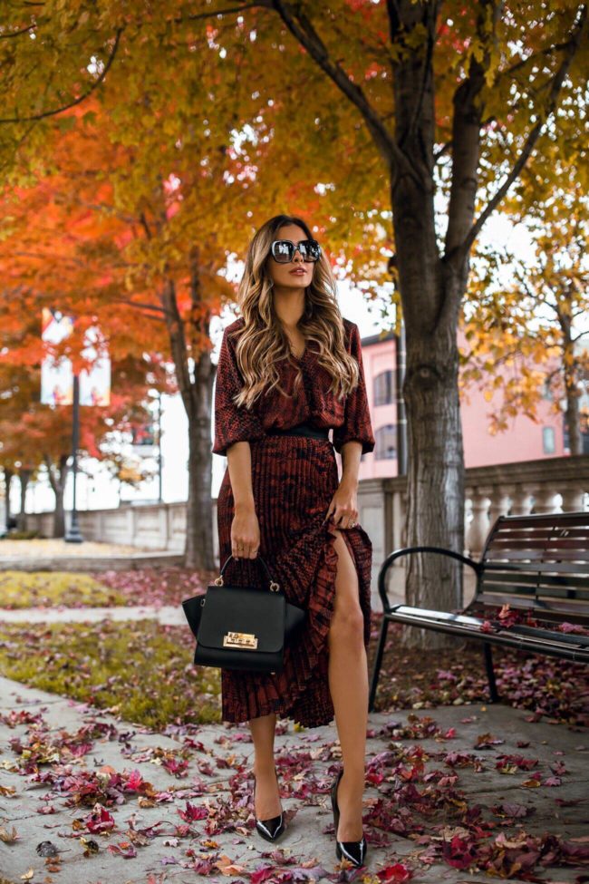 fashion blogger mia mia mine wearing a snakeskin print outfit from saks off 5th