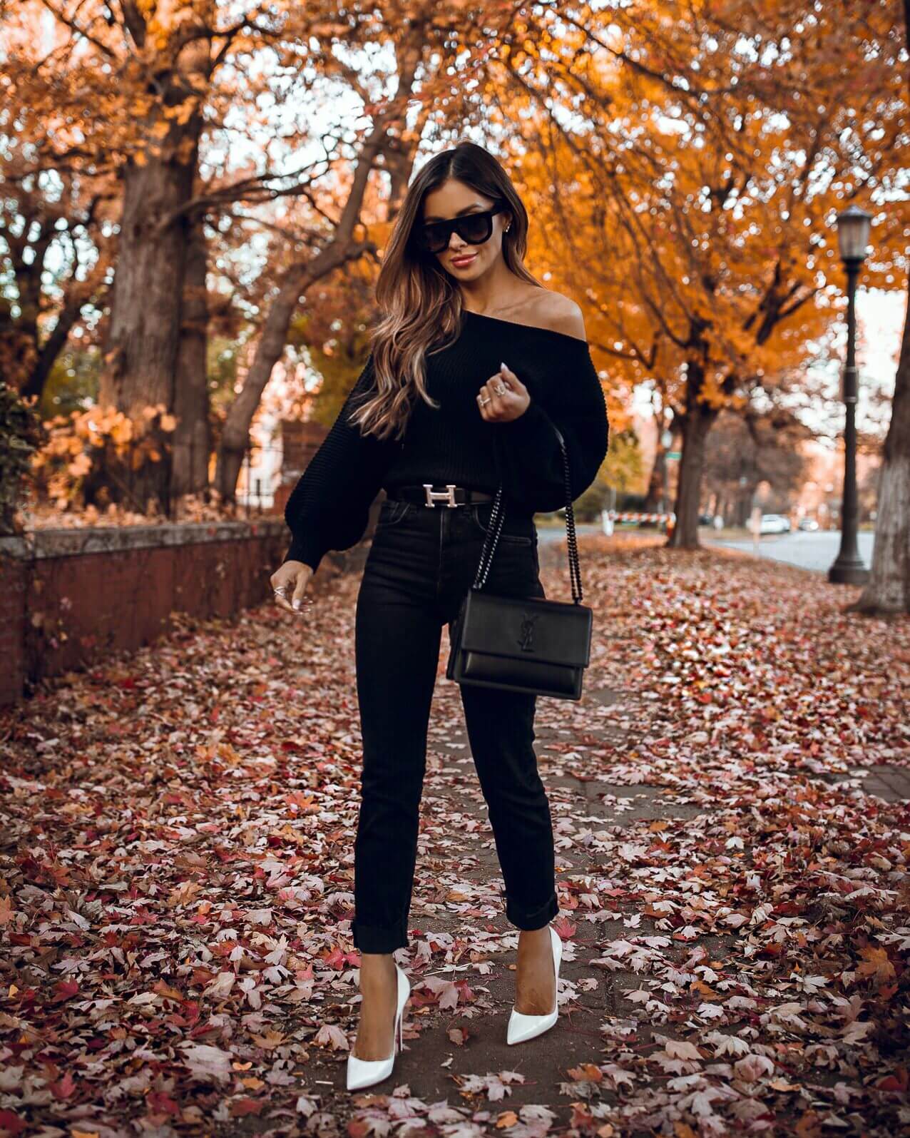 fashion blogger mia mia mine wearing a black outfit from revolve