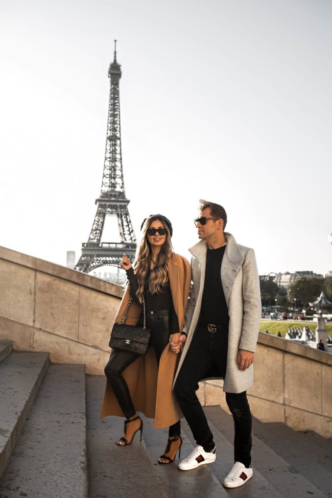 fashion blogger mia mia mine with husband phil thompson at the eiffel tower in paris