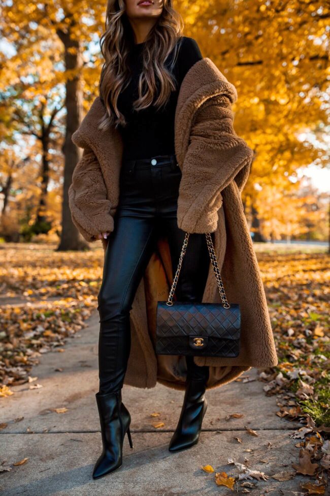 fashion blogger mia mia mine wearing a chanel bag and a max mara coat