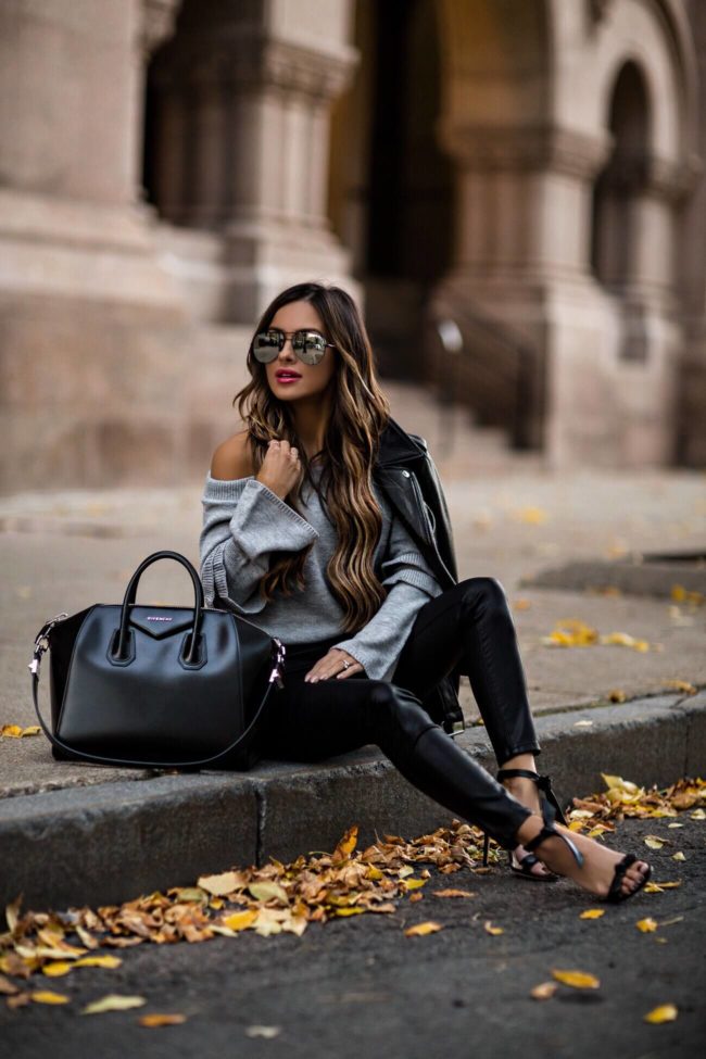 fashion blogger mia mia mine wearing a givenchy bag and black faux leather pants