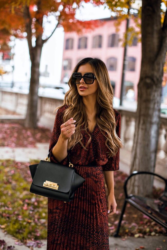 fashion blogger mia mia mine wearing a fall work outfit from saks off 5th