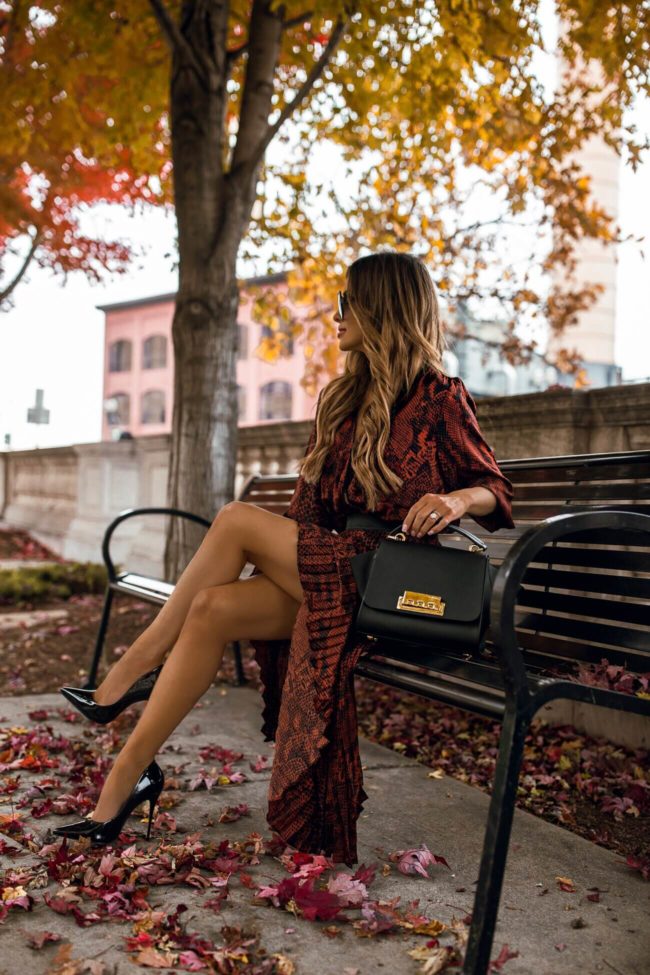 fashion blogger mia mia mine wearing a snakeskin print outfit for fall