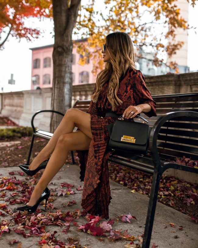fashion blogger mia mia mine wearing a snakeskin print outfit for fall