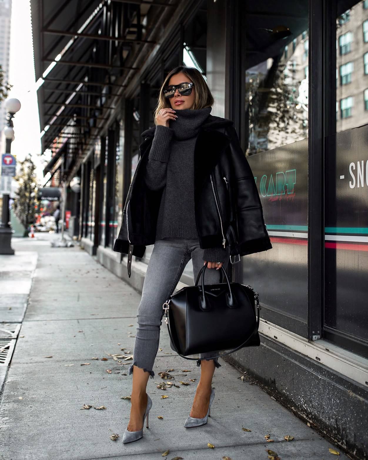 fashion blogger mia mia mine wearing gray jeans and a topshop biker jacket for fall