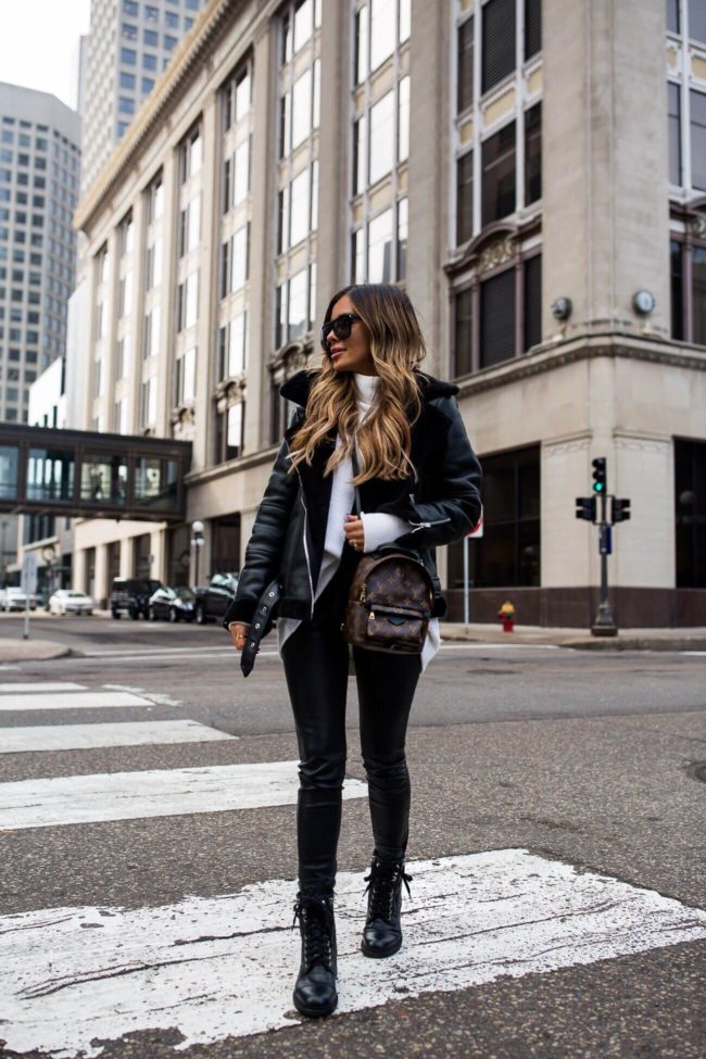 fashion blogger mia mia mine wearing a louis vuitton backpack from ebay