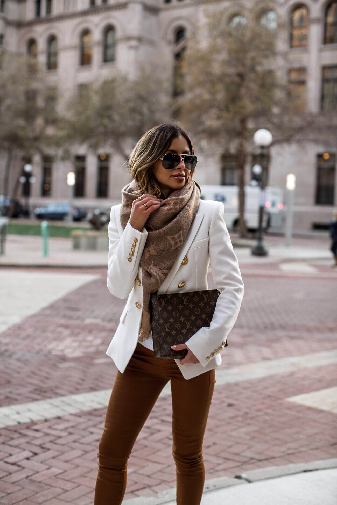 fashion blogger mia mia mine wearing a white balmain blazer and a louis vuitton scarf