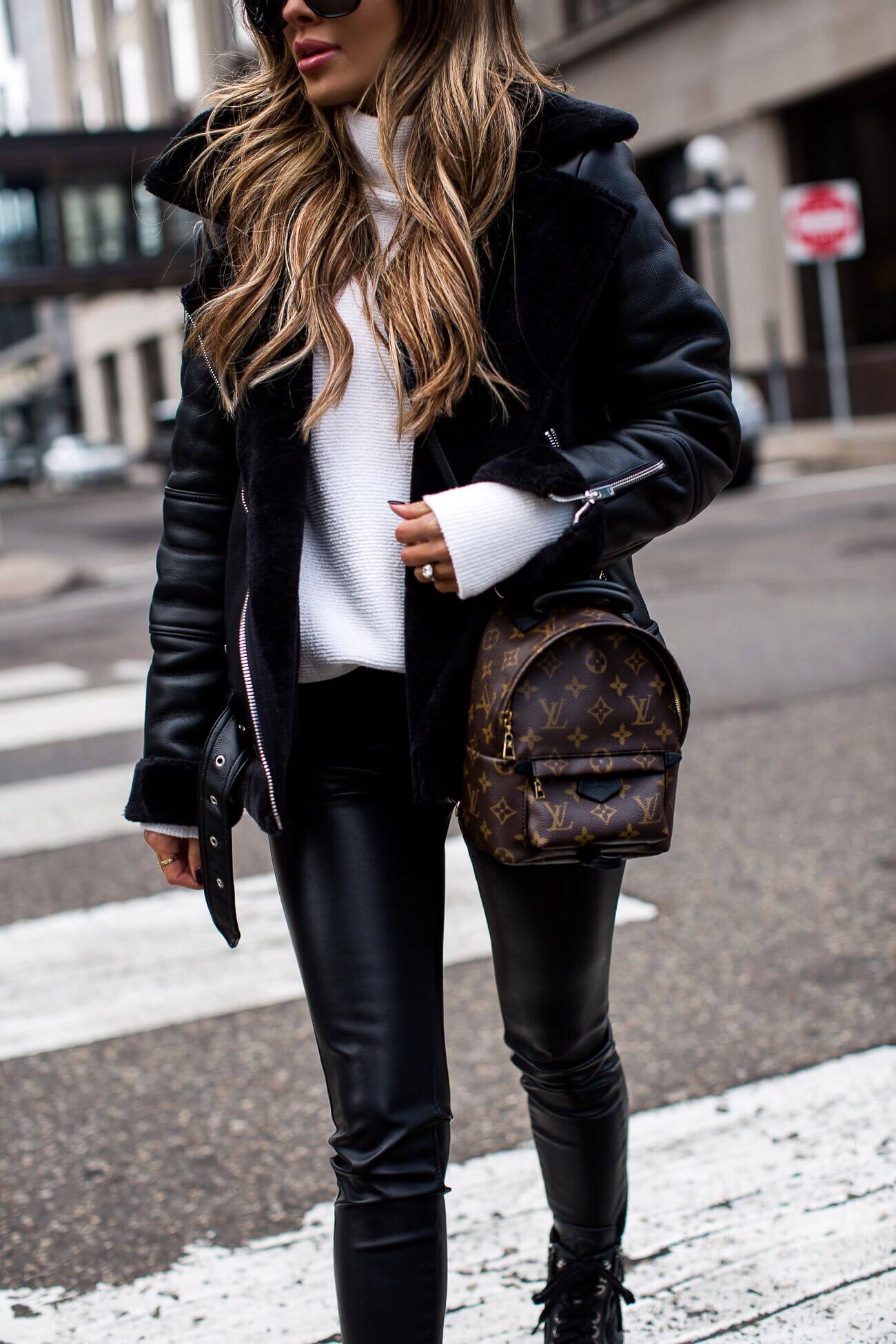 fashion blogger mia mia mine wearing a louis vuitton palm springs mini backpack