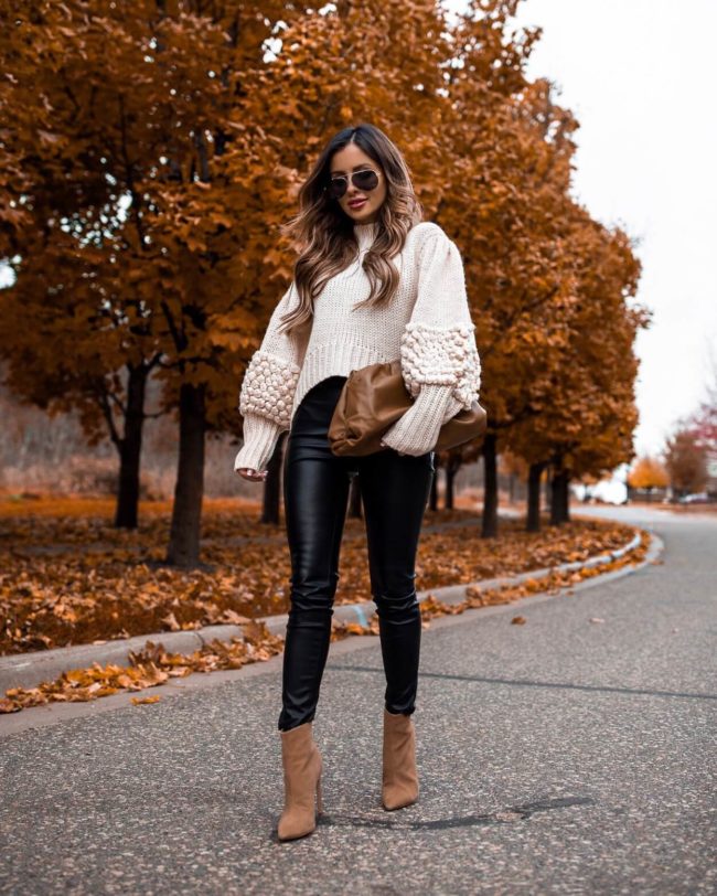 fashion blogger mia mia mine wearing a chunky sweater and tan suede booties from revolve