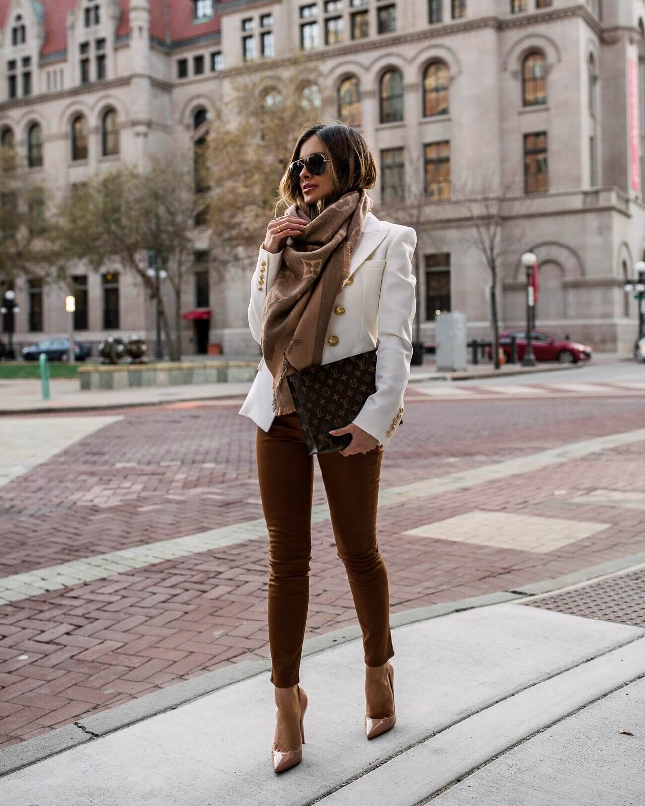 fashion blogger mia mia mine wearing a balmain blazer and a louis vuitton pouch 26