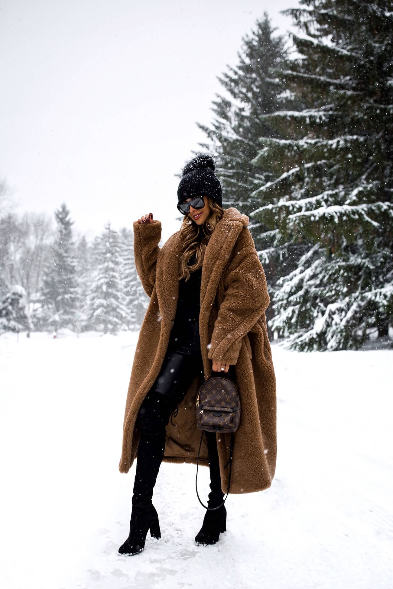 fashion blogger mia mia mine wearing a max mara camel coat and stuart weitzman over-the-knee-boots