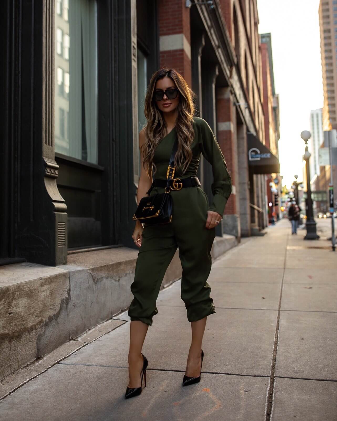 fashion blogger mia mia mine wearing an olive green jogger set from revolve