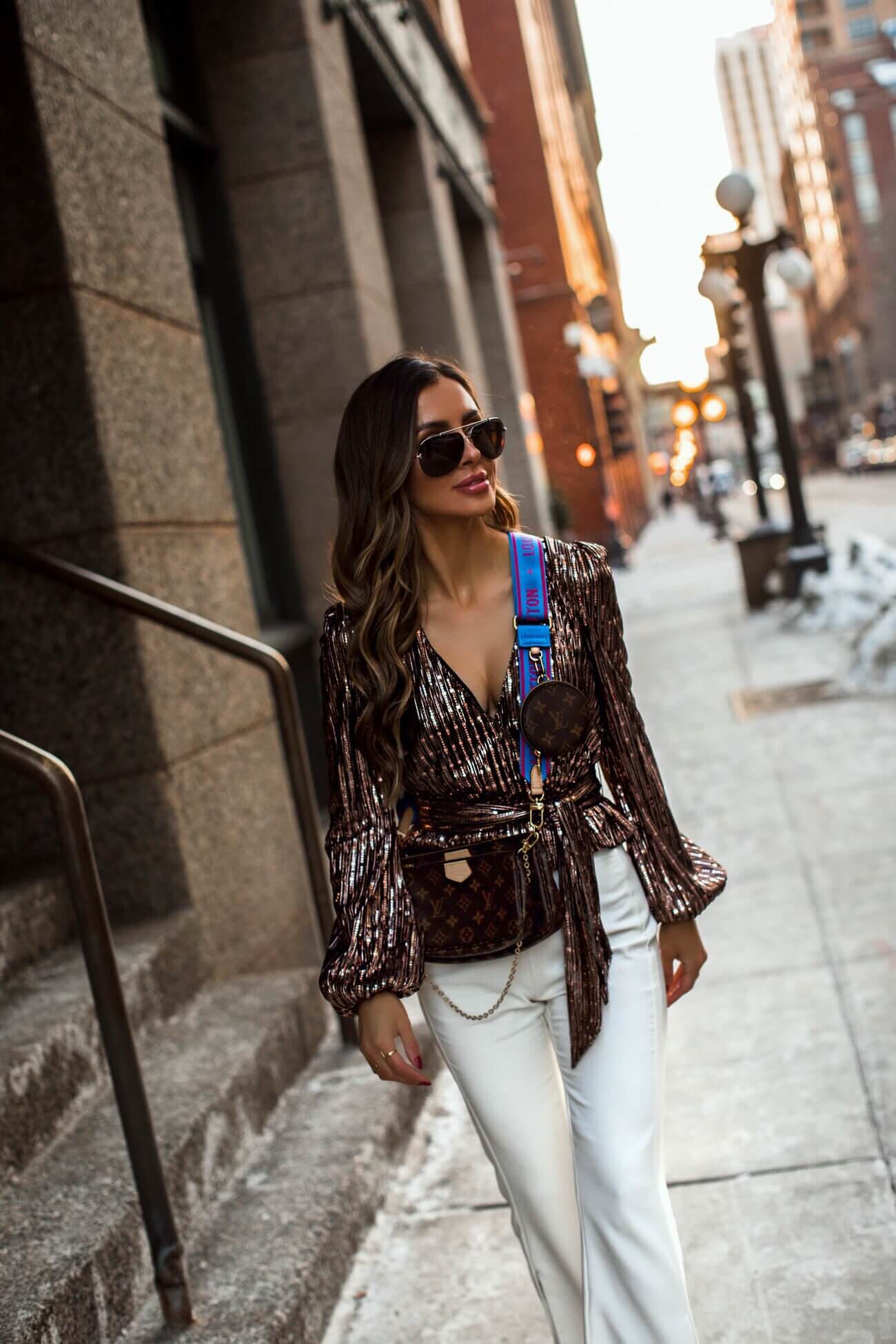 fashion blogger mia mia mine wearing a stockx louis vuitton bag for the holidays