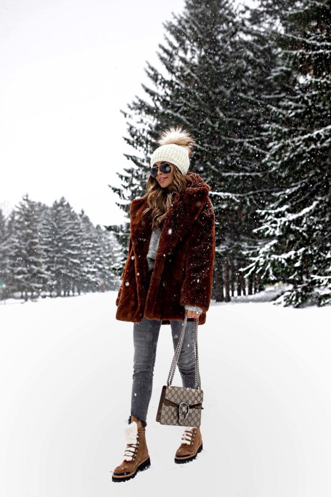 fashion blogger mia mia mine wearing a brown teddy bear coat from nordstrom with marc fisher winter boots