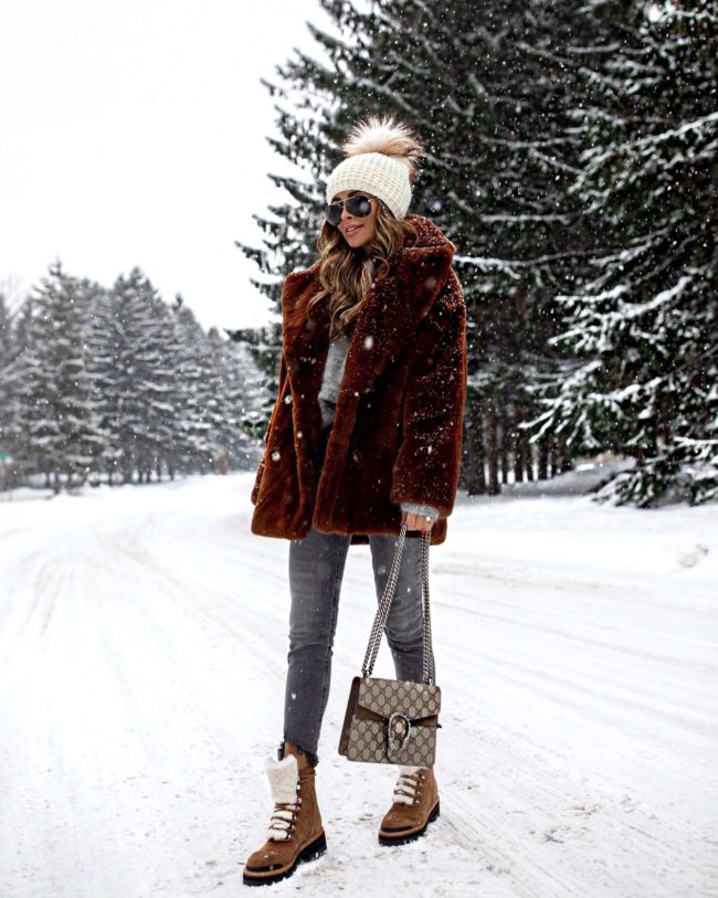 fashion blogger mia mia mine wearing a brown teddy bear coat from nordstrom with marc fisher winter boots