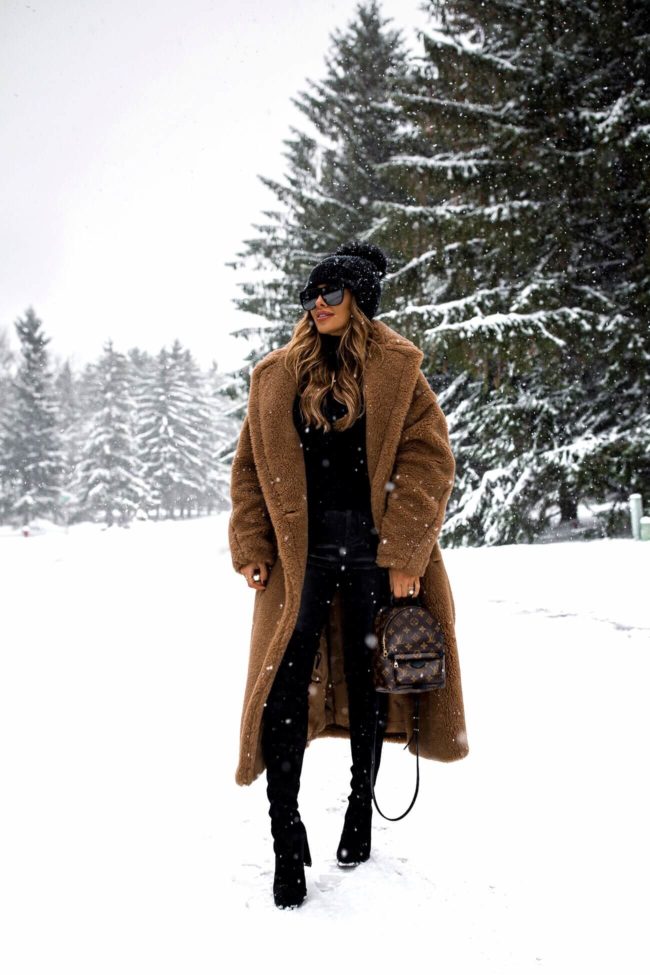 fashion blogger mia mia mine wearing a max mara coat and stuart weitzman over-the-knee boots from ebay
