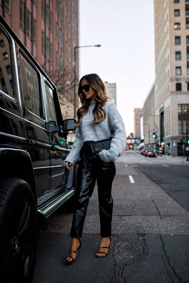 fashion blogger mia mia mine wearing a gray cozy sweater from express