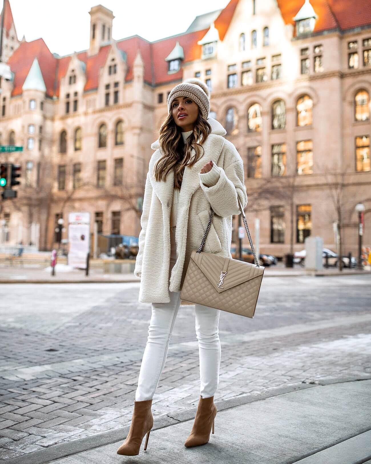 fashion blogger mia mia mine wearing a white teddy bear coat from H&M
