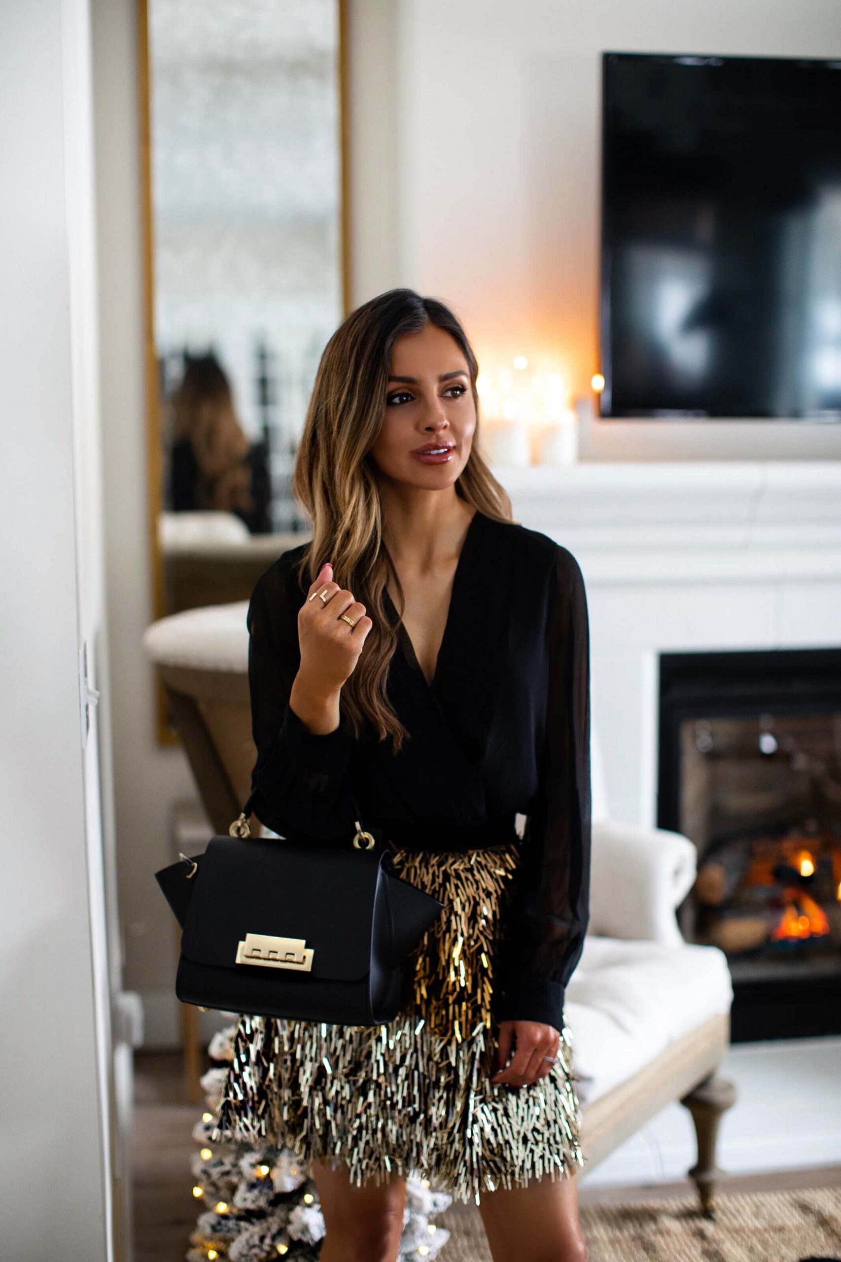 fashion blogger mia mia mine wearing a holiday outfit from Saks OFF 5TH