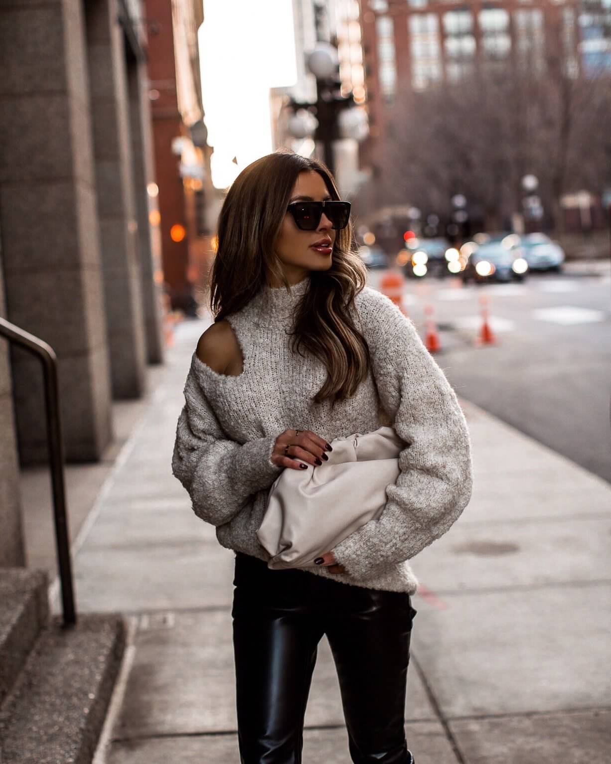 fashion blogger mia mia mine wearing a bottega veneta the pouch and faux leather pants