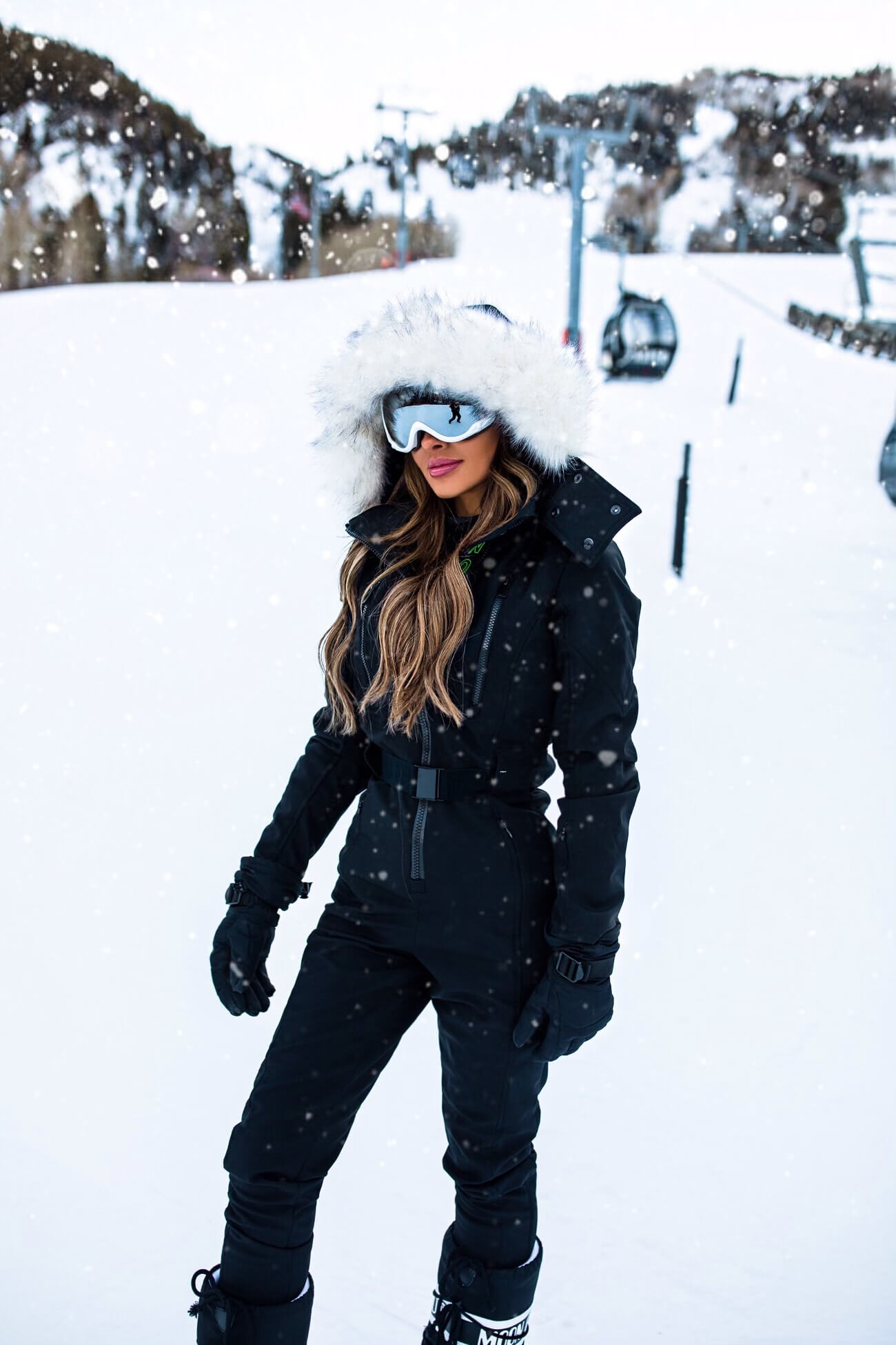 fashion blogger mia mia mine wearing a topshop sno suit from nordstrom