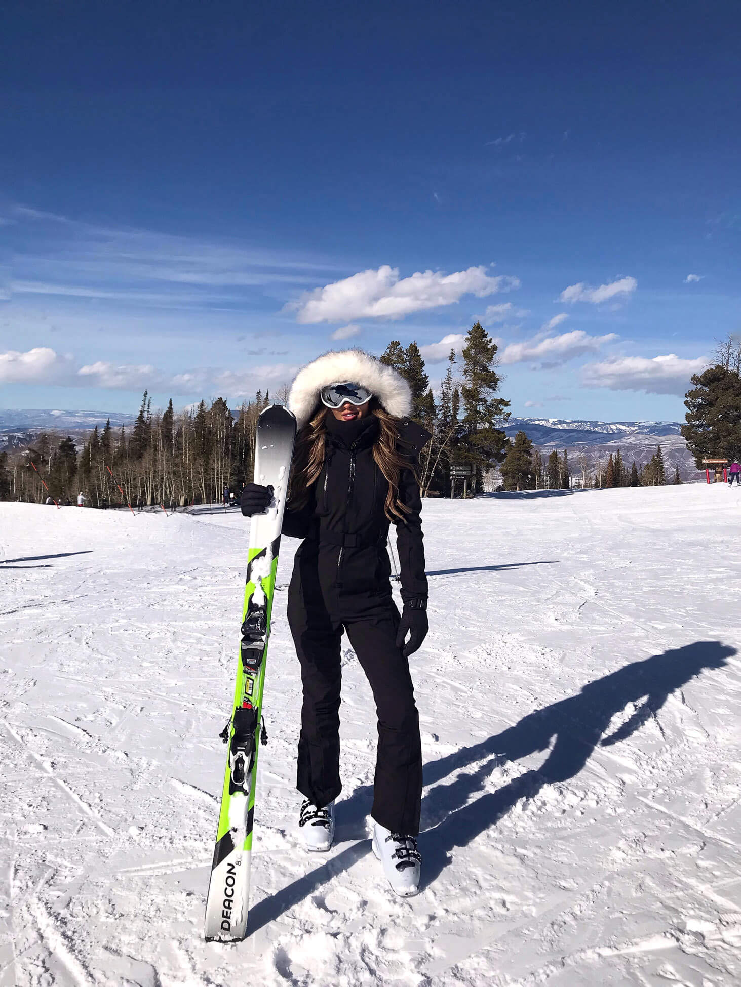 fashion blogger mia mia mine wearing a ski suit in colorado from nordstrom