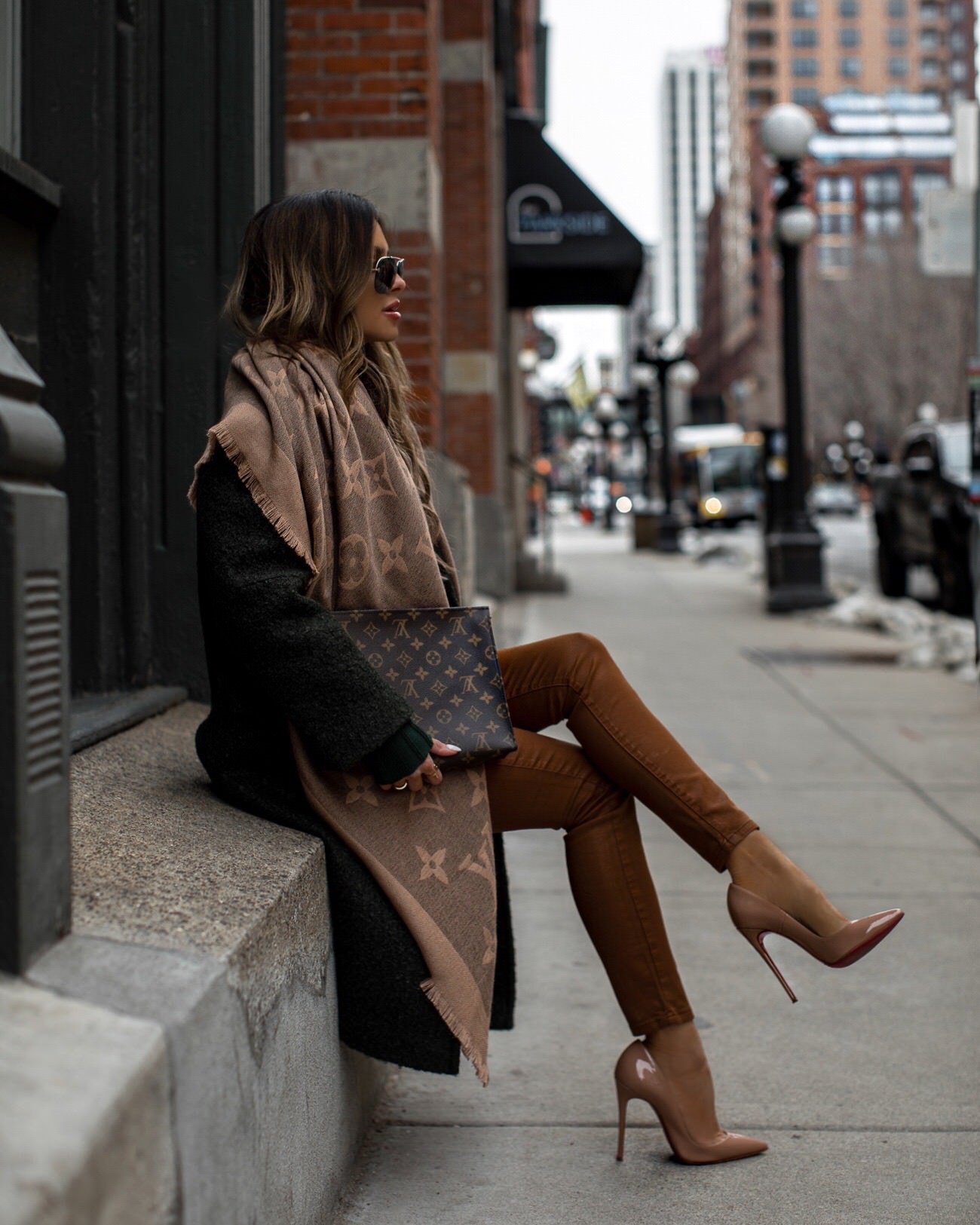 fashion blogger mia mia mine wearing a green coat and a louis vuitton scarf for winter