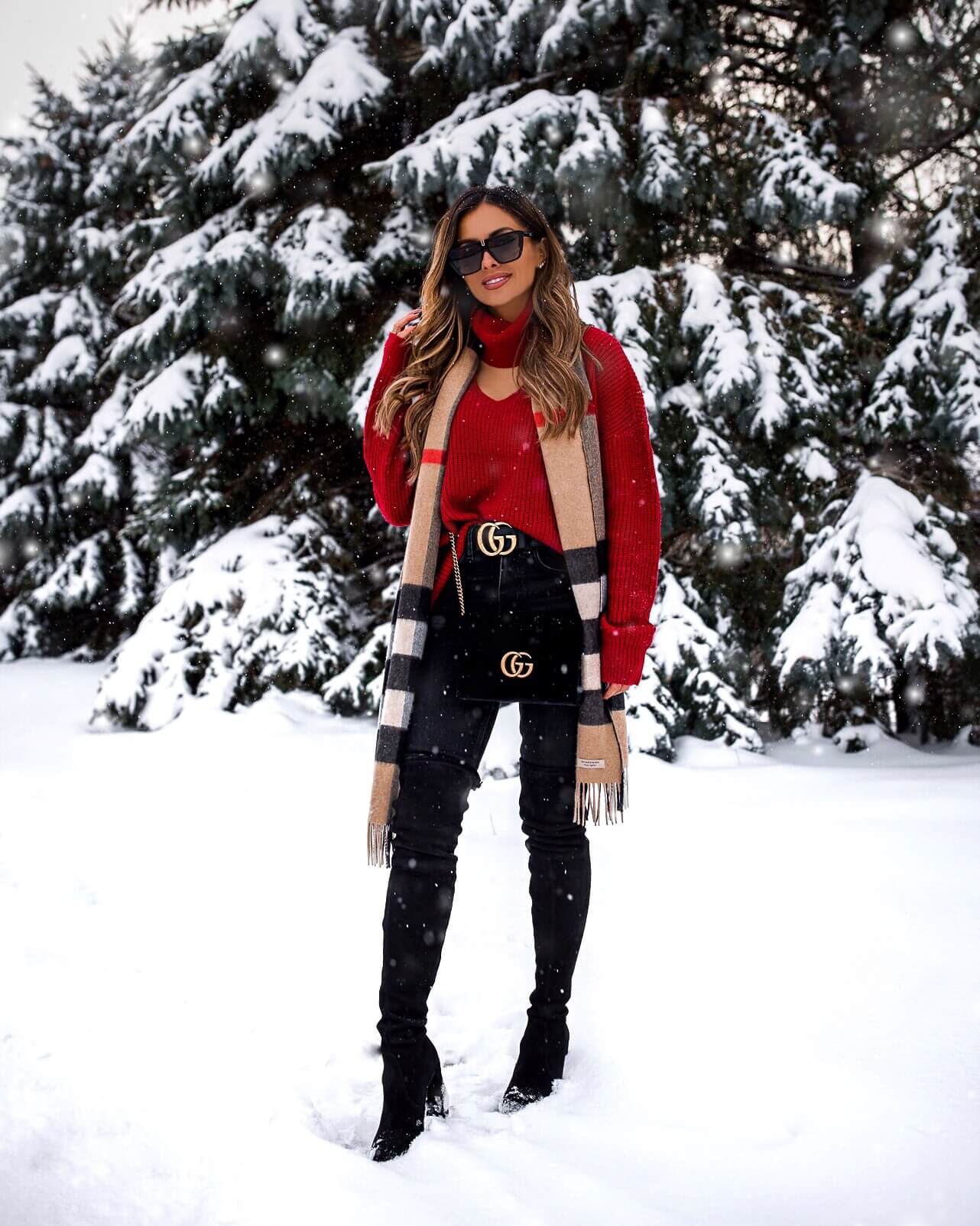 fashion blogger mia mia mine wearing a red sweater from revolve and a burberry scarf