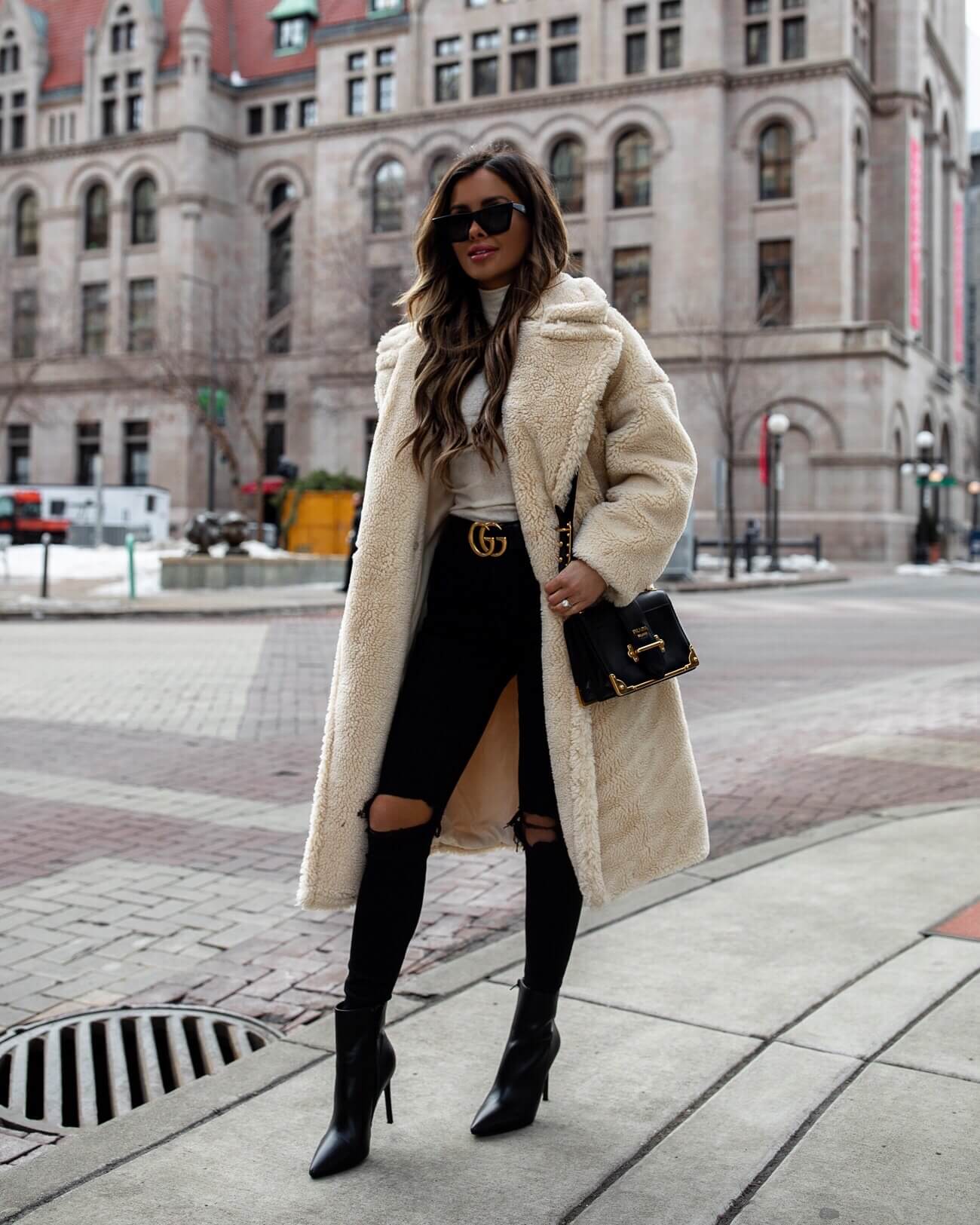 fashion blogger mia mia mine wearing a teddy bear coat with a gucci belt for winter